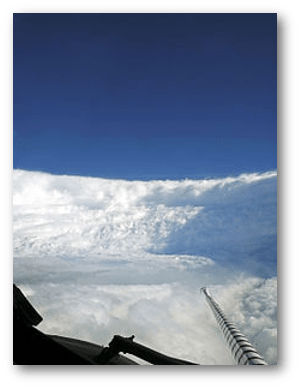 Murrow's description of Edna's eyewall - "What a beautiful sight.  We're in an ampitheater surrounded by clouds.  [The ocean] looks like a lovely alpine lake surrounded by snow" - also fits this 2005 image from a Hurricane Hunter flight into Hurricane Katrina.
