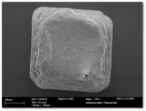 A single grain of table salt under an electronic microscope.  Image by Chhe