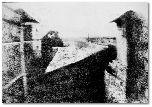 In heliography, asphalt hardened on the photographic plate in dark areas and remained after the plate was washed.  This is the oldest known camera photograph (1826-27).