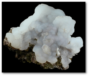 White chalcedony on yellow apatite crystals.  Source